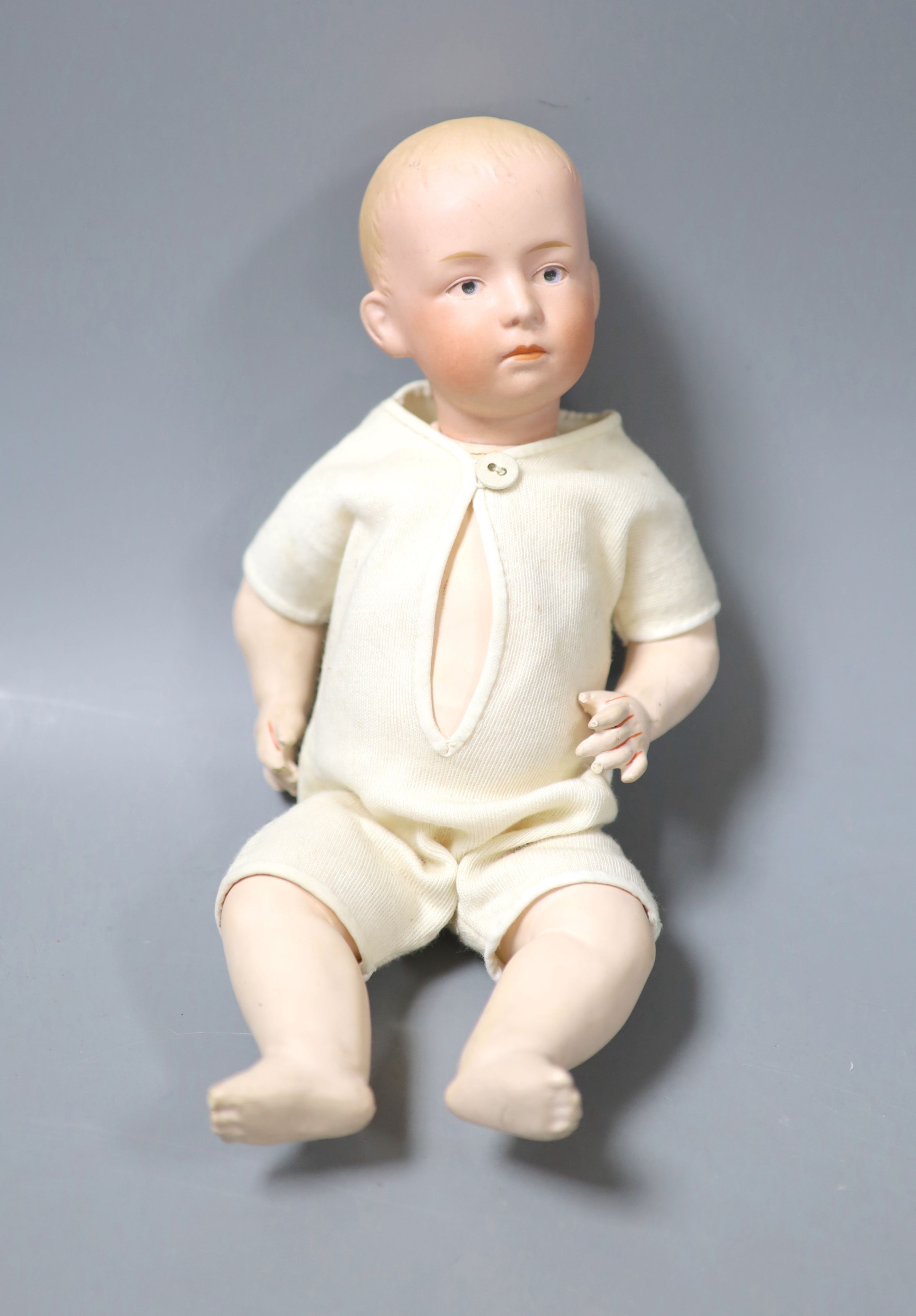 A Heubach baby, enlarged eyes, height 27cm